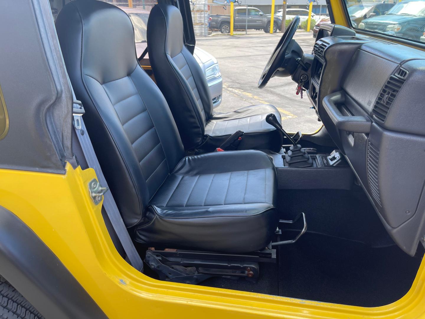 2000 Solar Yellow /Black Jeep Wrangler SE (1J4FA29P9YP) with an 2.5L 4 Cyl. engine, Manual transmission, located at 801 South State Street, Salt Lake City, UT, 84111, (801) 328-0098, 40.751953, -111.888206 - Wow extremely rare to find extra clean Jeep in immaculate condition 4x4! Low miles only 98,248 miles! Interior and exterior are both in excellent shape for the year. This is a clean title no reported accidents on the CarFax history report. It has passed emissions already and is ready to go. Featur - Photo#26